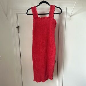 Coral body con dress with cinched detailing. Size S/M. Never worn.